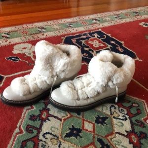 Warm white winter boots with faux fur details.